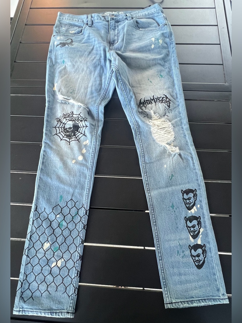 Broken Promises Jeans Size 34 Light Wash Distressed Graphic Denim.